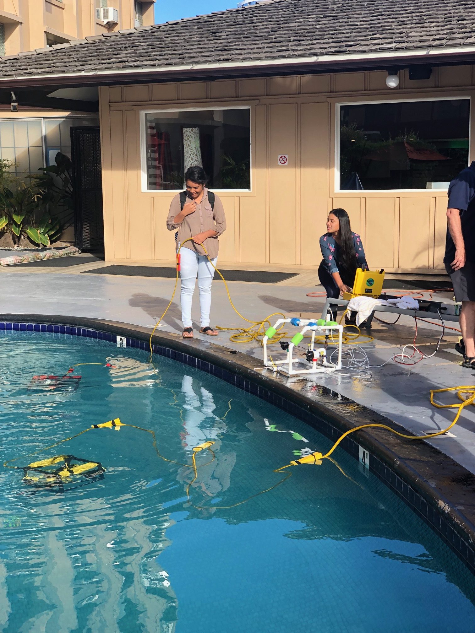 Students Operating ROVs In A Pool.